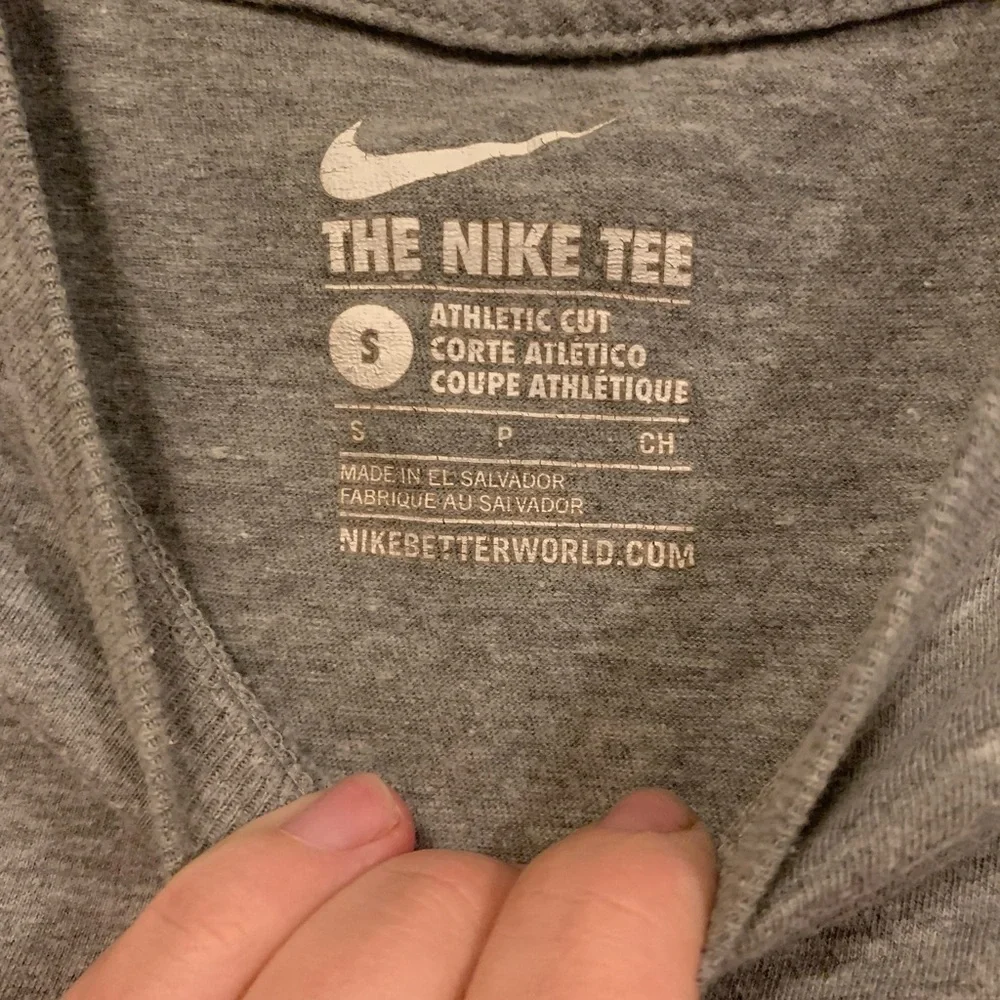 Nike grey and white tee with Nike‎ symbol